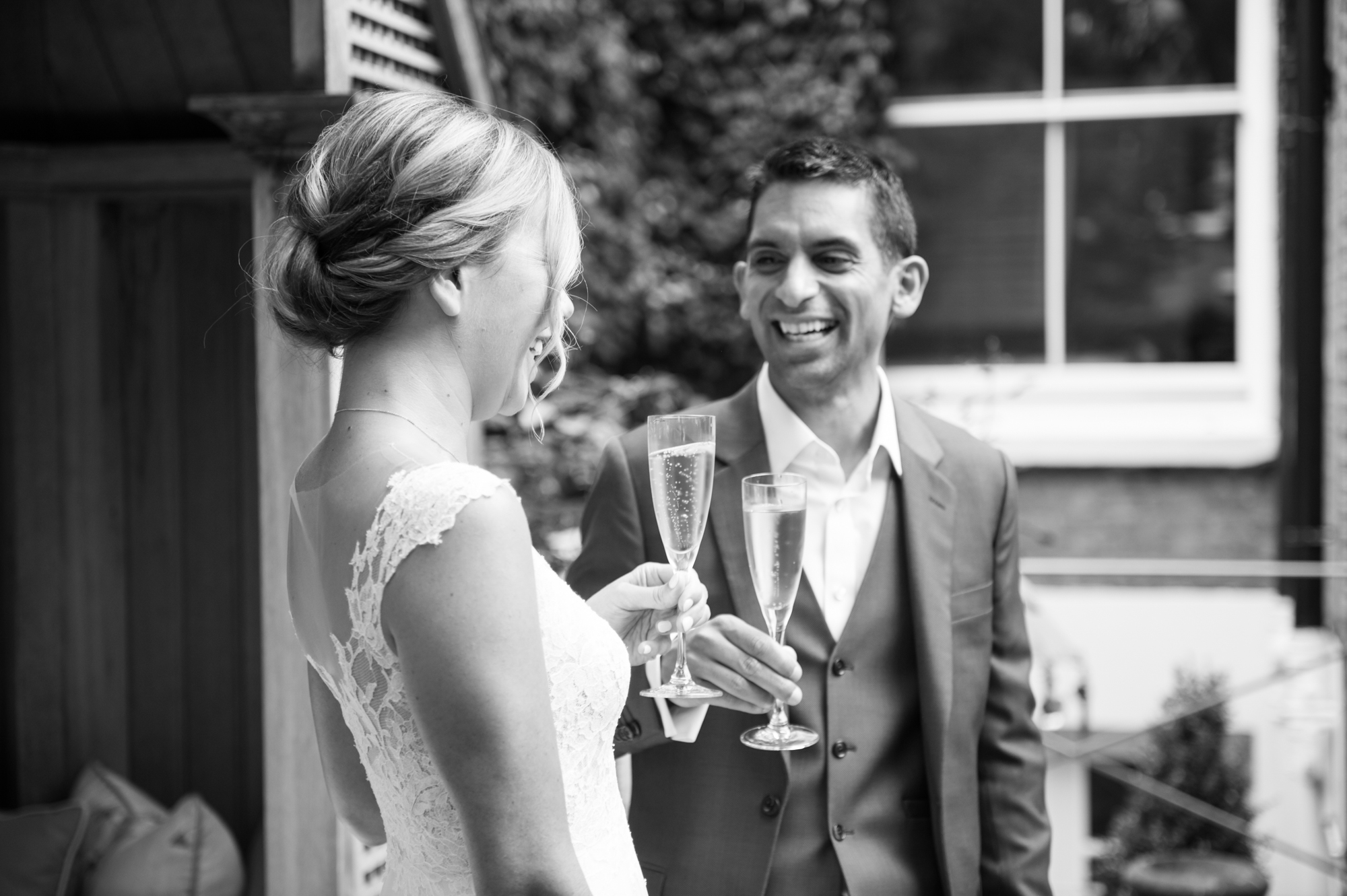bride and groom with champagne at their small city wedding photographed by especially amy